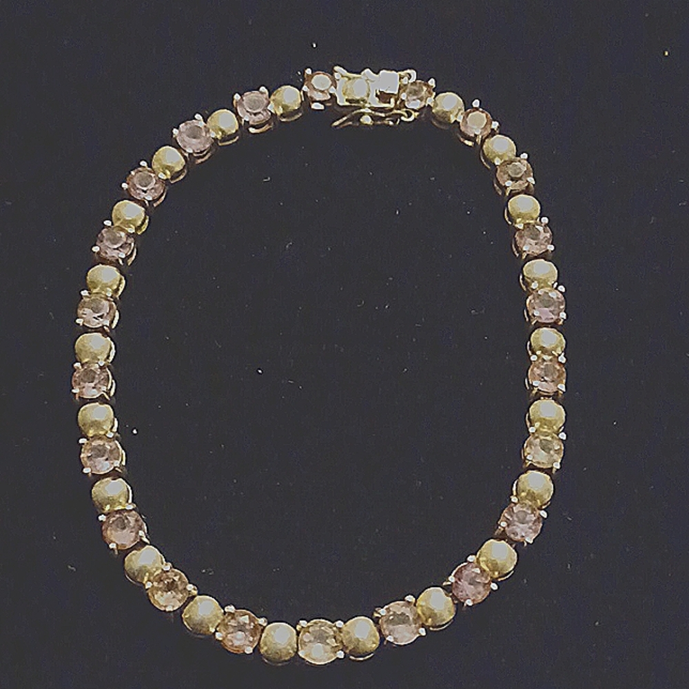 9.25 Amethyst 22 round stones separated by 22 silver round shaped beads.